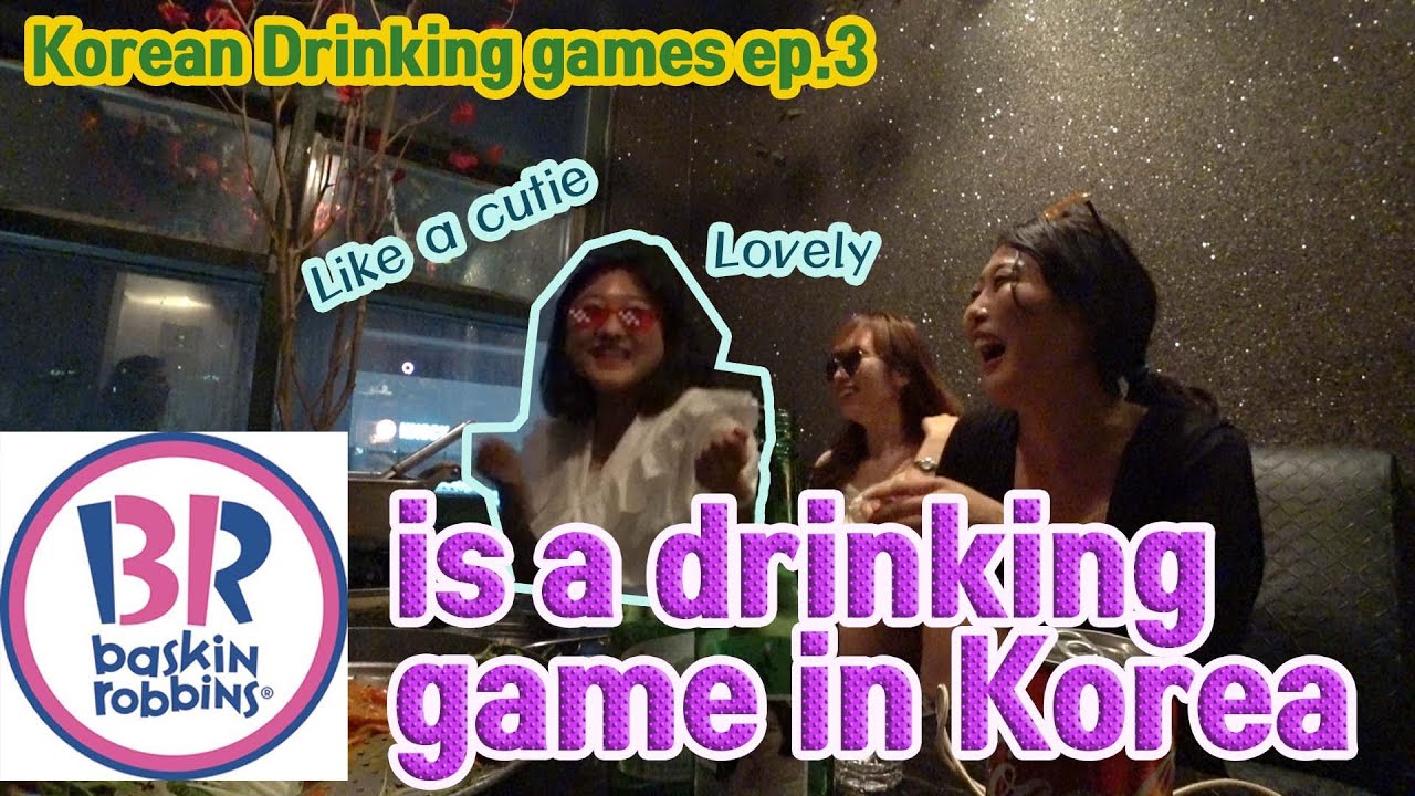 Korean friends playing the Baskin Robbins 31 drinking game with counting hand gestures around a table with soju glasses