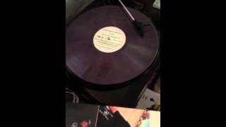 J.O.T. playing vinyl record with song "SO FAR AWAY" on turn