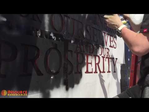 Working with local high school student on community art project at our Pittsfield warehouse