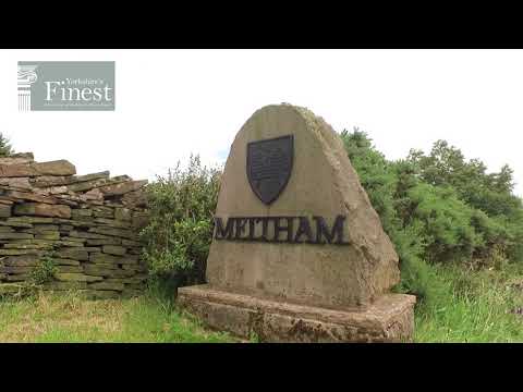The village of Meltham and a proposed building site for new homes