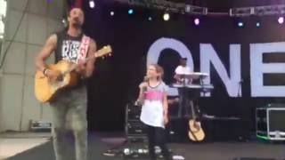 little girl sings with Micheal Franti