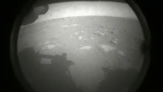 video: Mars landing: Nasa Perseverance rover sends back first image as it pulls off daunting mission
