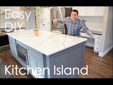 Part of a video titled Easy DIY Kitchen Island with seating, storage, microwave under cabinet ...