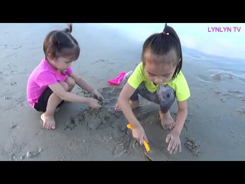 Kids Playing on the Beach and play with Sand.