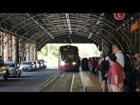 Urbos 3 tram number 2123 arriving and unloading passengers at Central Railway Station.