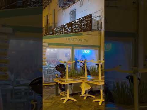 Walking around Ischia Porto at evening .