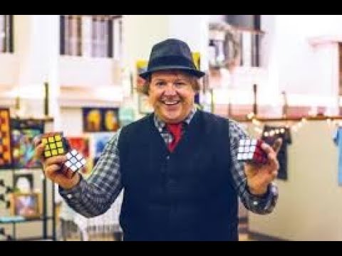 World Record - Solving 3 Rubik's Cubes While Juggling Them In 30 Seconds