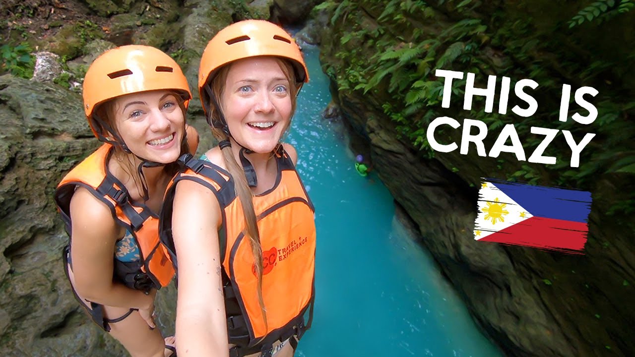 Travelers embark on a thrilling canyoneering adventure at Kawasan Falls.