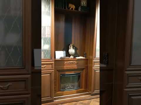 Раздвижная библиотека с камином.