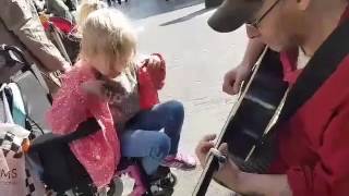 7 year old autistic blind girl in a wheel chair plays guitar for the first time