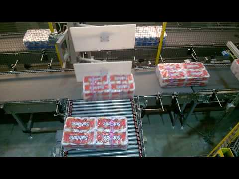Feeding toilet paper bundles to palettizer #43