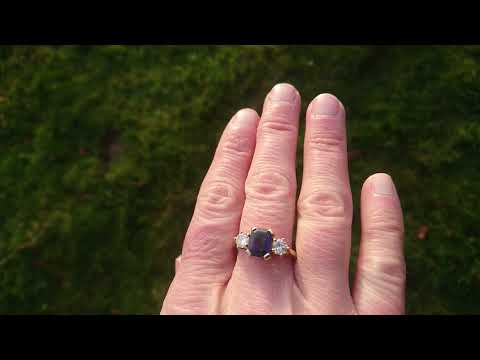 A classic three stone sapphire and diamond ring