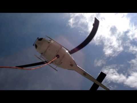 Huey UH-1H departure with bucket - Pacific Northwest