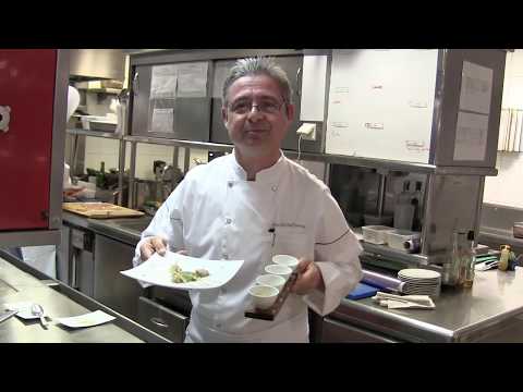 Chef Patron Jean-Michel Lorain prepares a dish at his 3 Michelin star restaurant