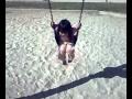 Cute Little Girl on Swing Giggling 