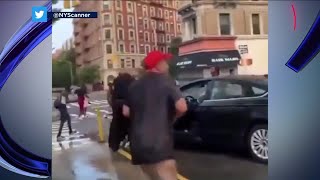 VIDEO: Cops doused with buckets of water on NY street
