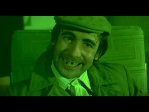 Official trailer frame: Roger Daltrey as Tommy in a blaze of lights, promising a rock-opera carnival of sound