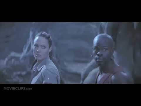 Trailer cuts: pagoda fight, wingsuit dive, volcanic cavern—music switches from hybrid action to choral myth