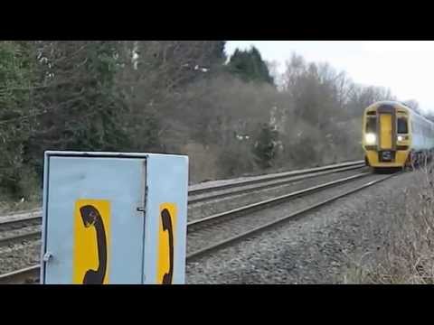 Arriva Trains Wales BR train on coastal railway in Flint area UK