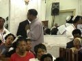 Apostle William Brown delivering a powerful sermon