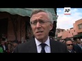 King visits site of cafe attack, French, UK ambassadors