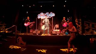 Tav Falco live onstage in Las Vegas: A glamorous fan enthusiastically dances in front of her hero