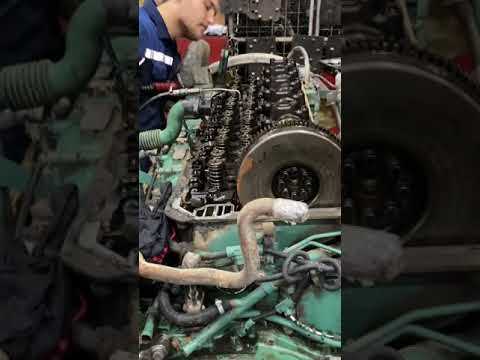 Volvo truck engine.  What is he doing? Truck repair #shorts
