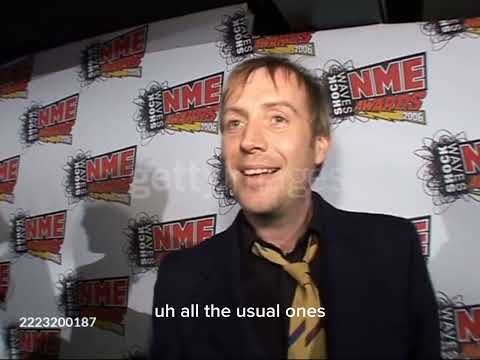 Rhys Ifans receives the award on behalf of Oasis at the NME Awards 2006.