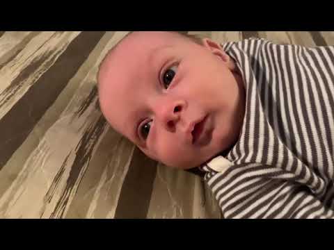 Cooing and smiling making cute baby noises