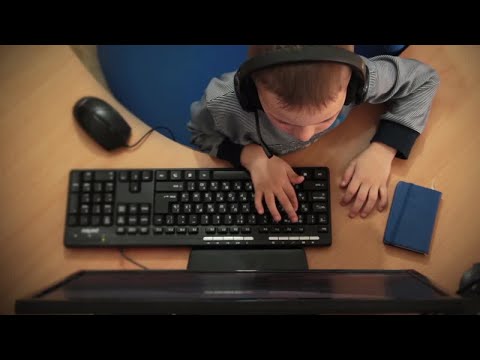 A Child Plays Computer Games Stock Video