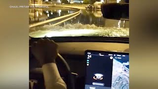 Tesla cuts through flood waters in Dubai while other cars got stuck