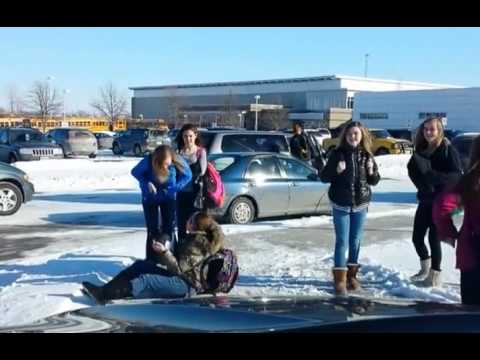 Mean daddy watching schoolkids slipping on ice