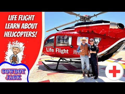 Red Life Flight helicopter with two men posing in front, cowboy-themed branding on the side, and a bold left panel reading 'Life Flight Learn About Helicopters' with a 'Cowboy Jack' logo and a medical cross symbol in the corner.