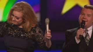 Adele gives the middle finger after being cut off by James Corden at The Brits