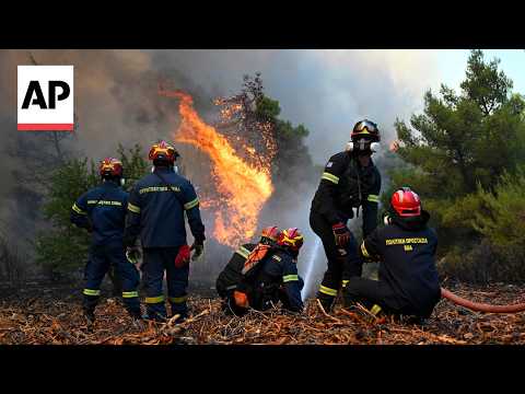 Video Thumbnail: Firefighters battle wildfire west of Athens as strong winds fuel flames