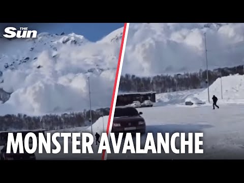 Moment skiers run for their lives as enormous avalanche engulfs Russian ski resort