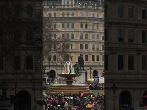 Crazy Irish Guys jump into fountain St Patrick's Paddy day Trafalgar square London March 2017