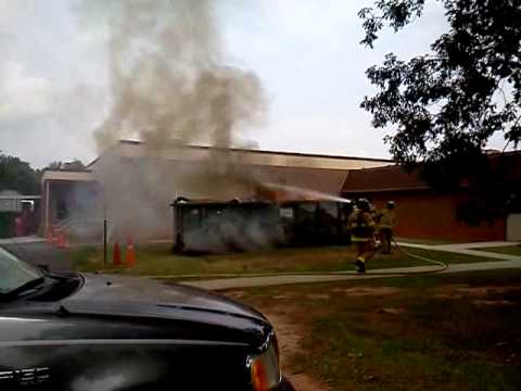 Careless worker flicked a cigarette in the trash!