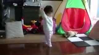 baby spins and walks and dances on tiptoes.