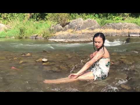 Cute girl take bath alone in the river