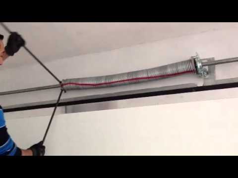 COMO TENSAR LOS MUELLES DE UNA PUERTA SECCIONAL