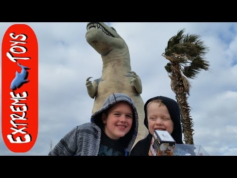 Huge Dinosaur Toy Store! And Playing on Big Dinosaur Statues. Video