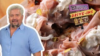 Guy Fieri Eats Roman-Style Pinza Puttanesca | Diners, Drive-Ins and Dives | Food Network