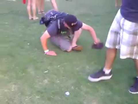 Drunk Guy at Coachella Can't Put His Flip Flops On