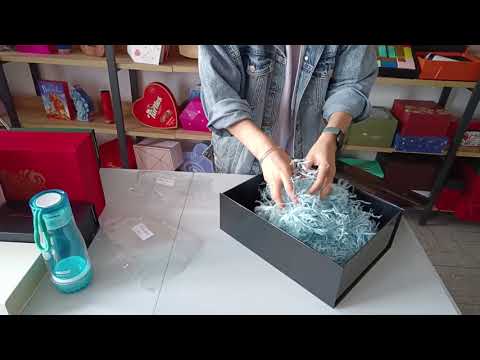 Black gift box with paper filler