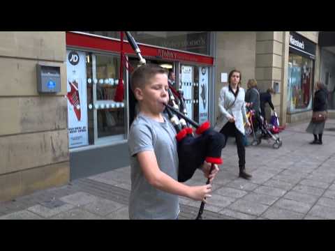 Merry Christmas From Young Scottish Bagpipers In Scotland