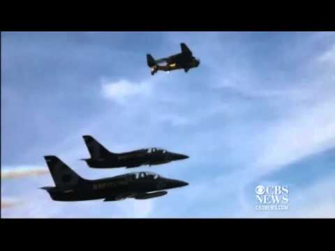 Stuntman flies alongside jets