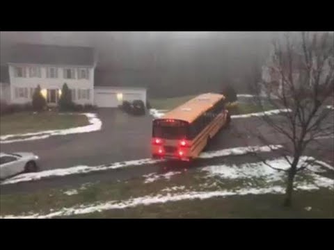 Out-of-control school bus slides down icy street, hits car in Massachusetts