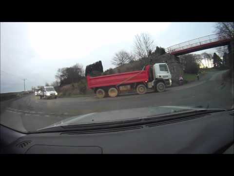 cyclist falls in front of lorry