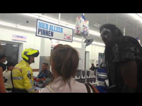 A seven-foot tall man goes shopping dressed as an Uruk-hai.